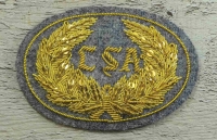 Offiziershutabzeichen CSA grauer Hintergrund goldene Schrift